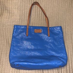 Blue textured Kate Spade tote bag with leather straps and magnetic closure